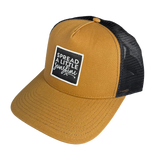 Yellow cap with black mesh back and white text logo on a white background
