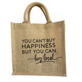 Jute bag with 'You can't buy happiness but you can buy local' text on a white background